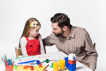 Image showing The daughter and father drawing together