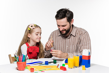 Image showing The daughter and father drawing together