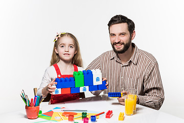 Image showing Father and daughter playing educational games together 