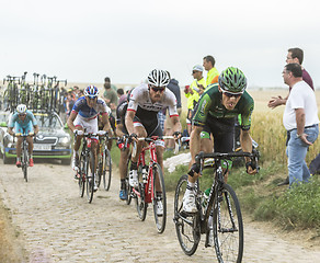 Image showing Inside the Peloton on a Cobblestone Road - Tour de France 2015