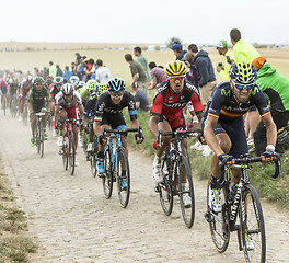 Image showing The Peloton on a Cobblestone Road - Tour de France 2015