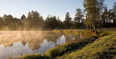 Image showing Golden morning fog over pond