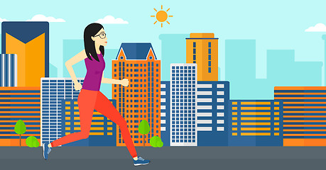 Image showing Sportive woman jogging.