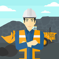 Image showing Miner with mining equipment on background.