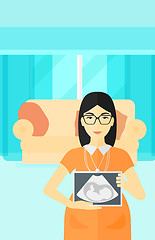 Image showing Pregnant woman with ultrasound image.