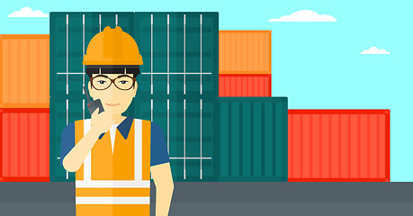 Image showing Stevedore standing on cargo containers background.