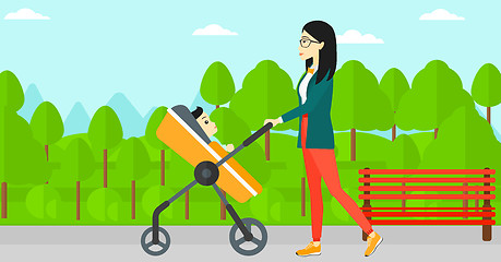 Image showing Woman pushing pram.