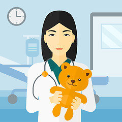 Image showing Pediatrician holding teddy bear.