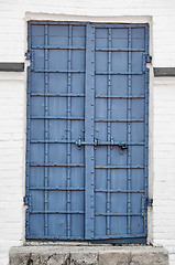 Image showing Reinforced Iron Door with Rivets and Security Bolt