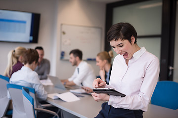 Image showing business woman on meeting  using tablet