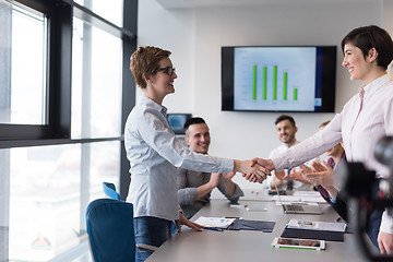 Image showing business womans handshake