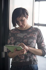 Image showing business woman working on tablet