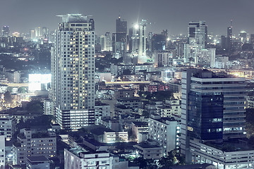 Image showing Downtown night scene, beautiful modern buildings, bright glowing