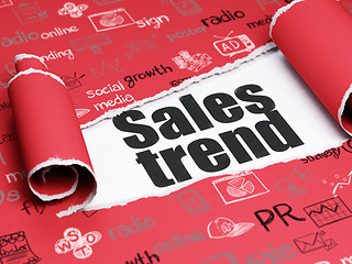 Image showing Advertising concept: black text Sales Trend under the piece of  torn paper