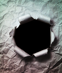Image showing Crumpled Paper Background with Big Black Hole Punched Through