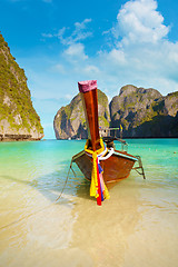 Image showing Traditional Longtail Boat Tied to a Tropical Beach in Thailand