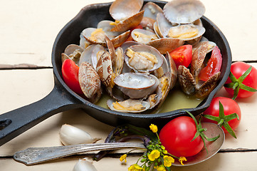 Image showing fresh clams on an iron skillet