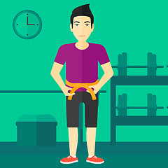 Image showing Man measuring waist.