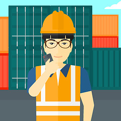 Image showing Stevedore standing on cargo containers background.