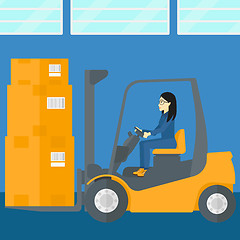 Image showing Warehouse worker moving load by forklift truck.