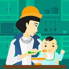 Image showing Woman feeding baby.