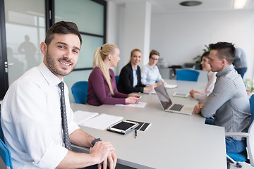 Image showing young business people group on team meeting at modern office