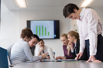 Image showing young  woman using  tablet on business meeting