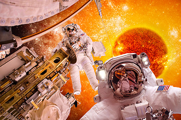 Image showing Spacecraft and astronauts in space on background sun star