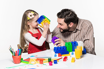 Image showing Father and daughter playing educational games together 