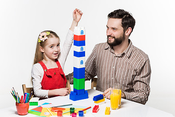 Image showing Father and daughter playing educational games together 