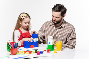 Image showing Father and daughter playing educational games together 