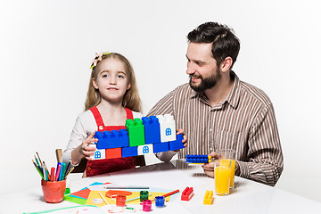 Image showing Father and daughter playing educational games together 