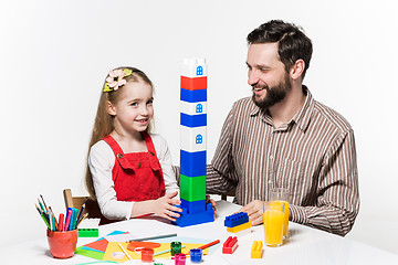 Image showing Father and daughter playing educational games together 