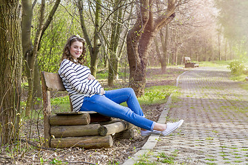 Image showing beautiful pregnant woman outdoor in the park on banch