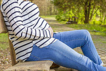 Image showing beautiful pregnant woman outdoor in the park on banch