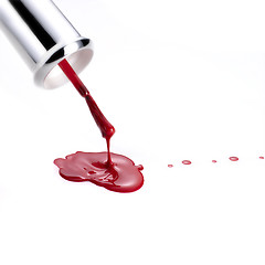 Image showing Red Nail Polish and brush dripping