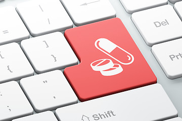 Image showing Medicine concept: Pills on computer keyboard background