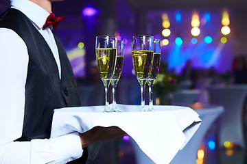 Image showing Waiter serving champagne on a tray