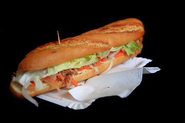 Image showing baguette on the black background