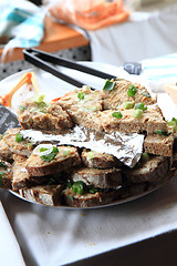 Image showing cracklings spreading with bread