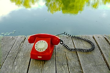 Image showing Old telephone in nature