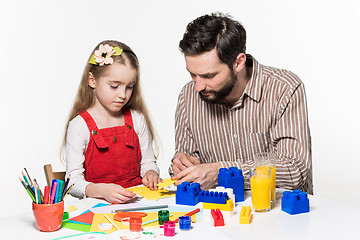 Image showing Father and daughter playing educational games together 