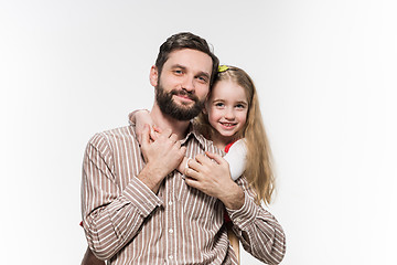 Image showing Girl hugging her father  over a white background