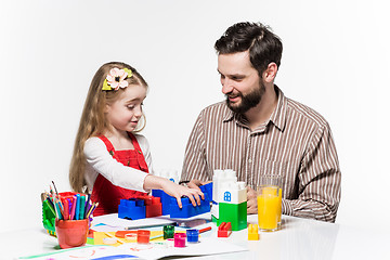 Image showing Father and daughter playing educational games together 