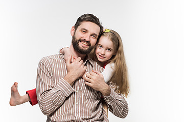 Image showing Girl hugging her father  over a white background