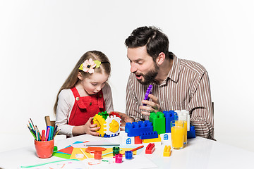 Image showing Father and daughter playing educational games together 