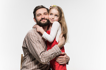 Image showing Girl hugging her father  over a white background