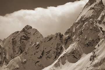 Image showing Snowy mountains in clouds