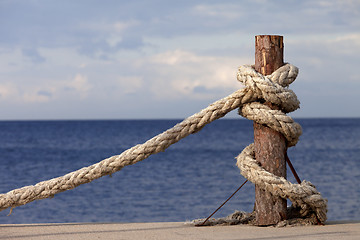 Image showing Rope on seafront and cloudy sky in autumn