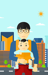 Image showing Man holding baby in sling.